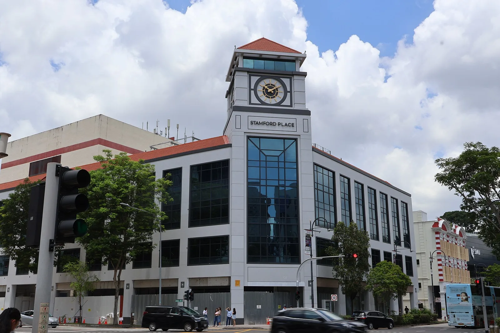 The same corner in March 2026, renamed Stamford Place with a new pale facade, as the refit neared completion. Photo: Actuall7, CC BY 4.0, via Wikimedia Commons (resized).